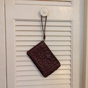 Coach Burgundy Embossed Wristlet